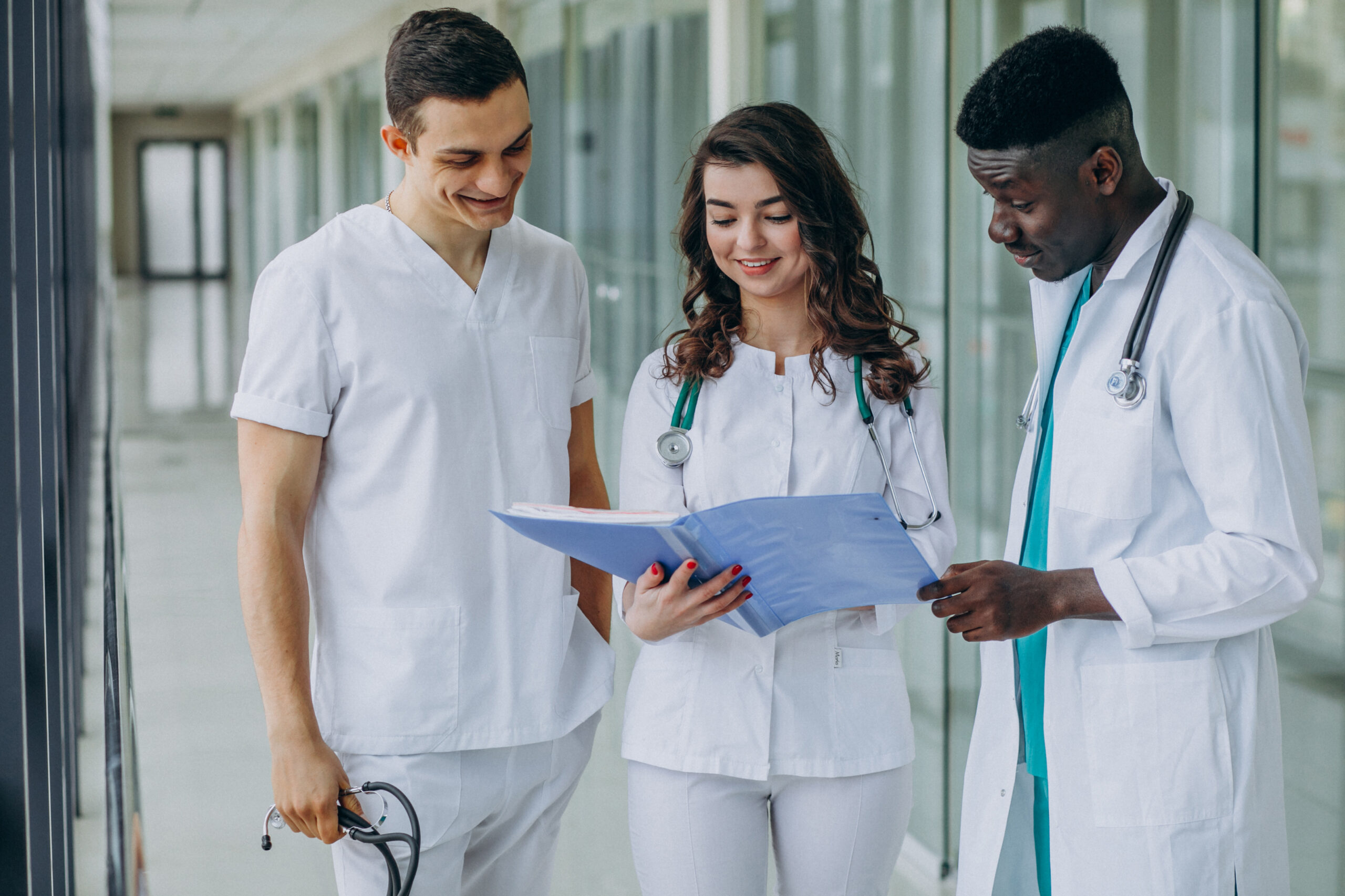 team-young-specialist-doctors-reviewing-documents-corridor-hospital
